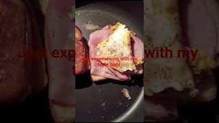 experiencing with my taste buds ,Grilled cheese with ham and bacon &over easy egg subscribe to Chan