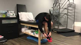 Seated Knee Traction Mobilization With Ankle Weights