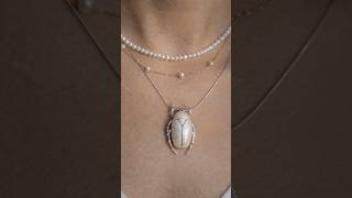 A small piece of natural history, reimagined in pearls, lace, sterling silver, and enamel