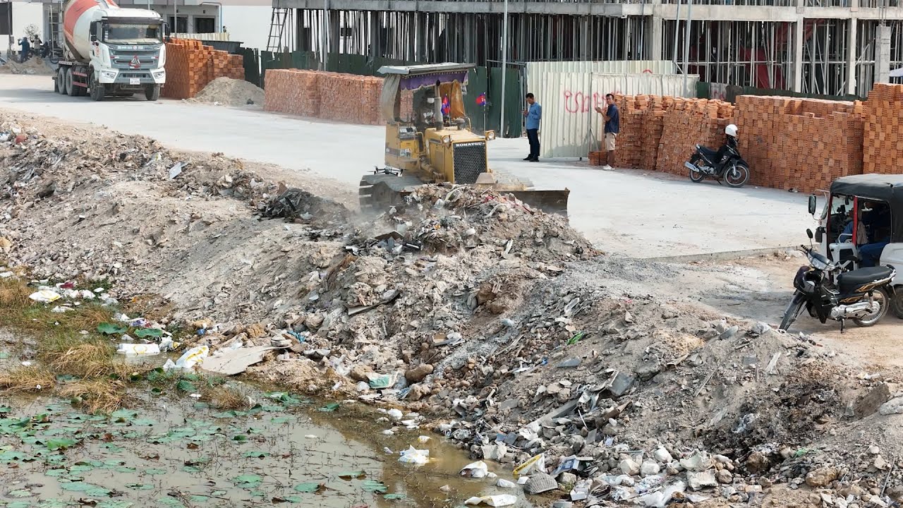 Good Skill KOMATSU Dozer Operator Filling And Push Stones On The Flooded Area