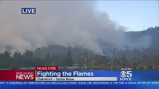 NUNS FIRE GIVES BIRTH TO NEW BLAZE:  Firefighters battle an offshoot of the Nuns Fire near Sonoma