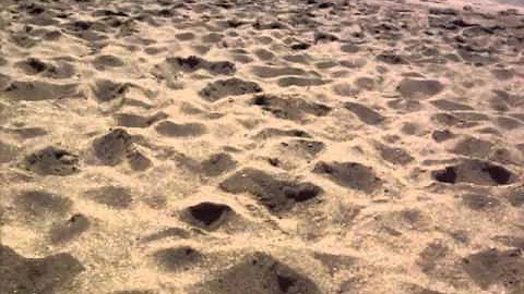 My feet in the Green sand beach,Very windy