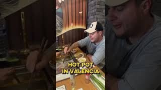 Ed Kuzmin eating hot pot in Valencia, Spain 🇪🇸