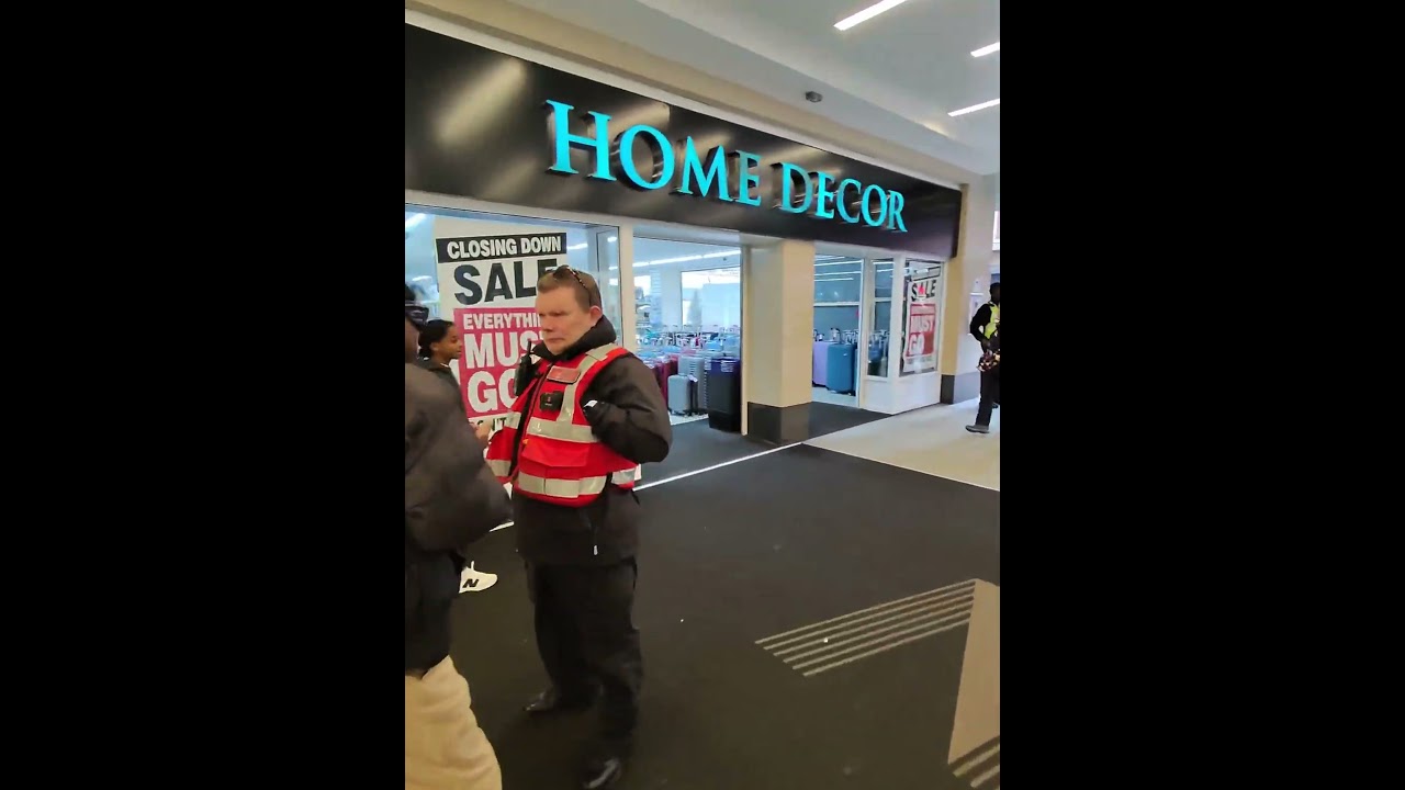 Street security talking to the electric lightbulb man Joseph 