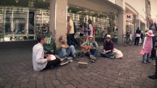 Three German students surprise a homeless guy