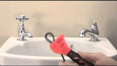 Using a Strap wrench  in plumbing.