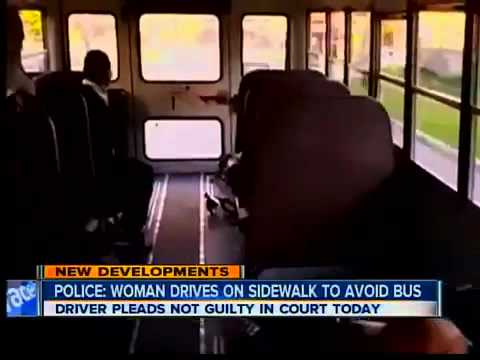 Driver passes bus on sidewalk