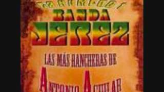 Video thumbnail of "LA NUMERO UNO BANDA JEREZ UN PUNO DE TIERRA"