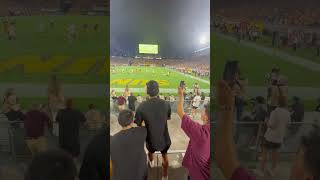 Two guys fall off ledge at football game