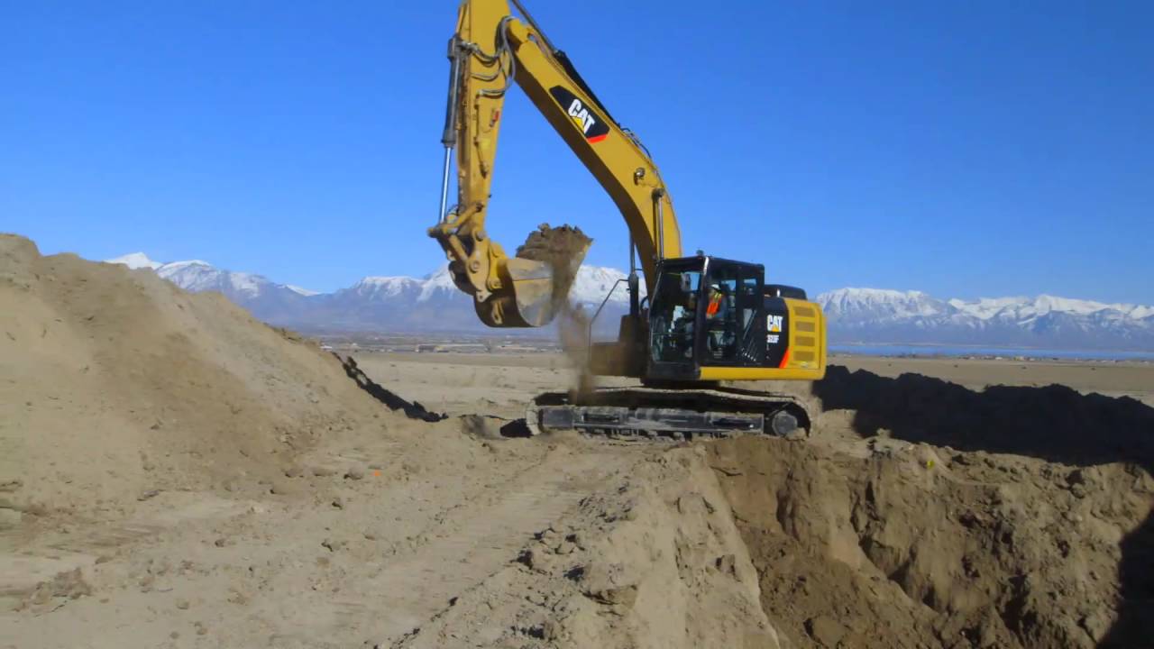 caterpillar stock price Cat® 323 Excavator Digging a Basement With Grade Assist