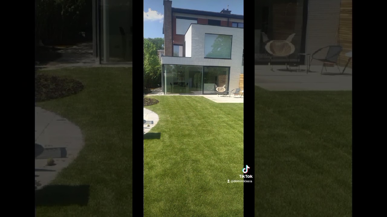 landscape design cobblestone tiles and natural stone and grass lawn