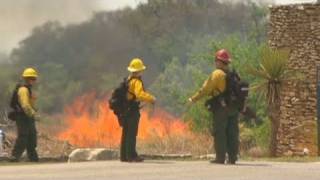CNN: Western wildfires eat up Texas