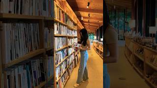 Reading A Book At A Beautiful Bookstorecafe