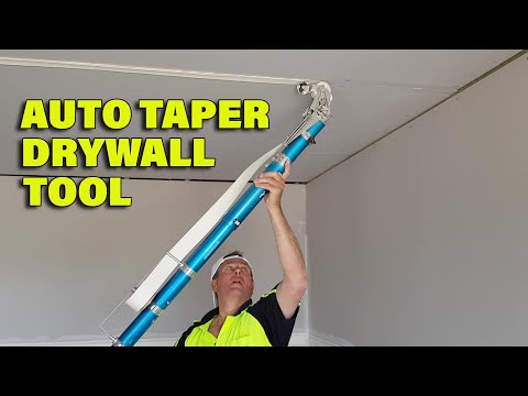 Drywall Taper Working an Auto Taping Tool