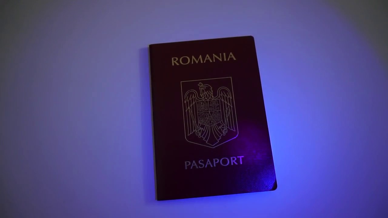 Hidden texts on passport visible under UV light (395nm)