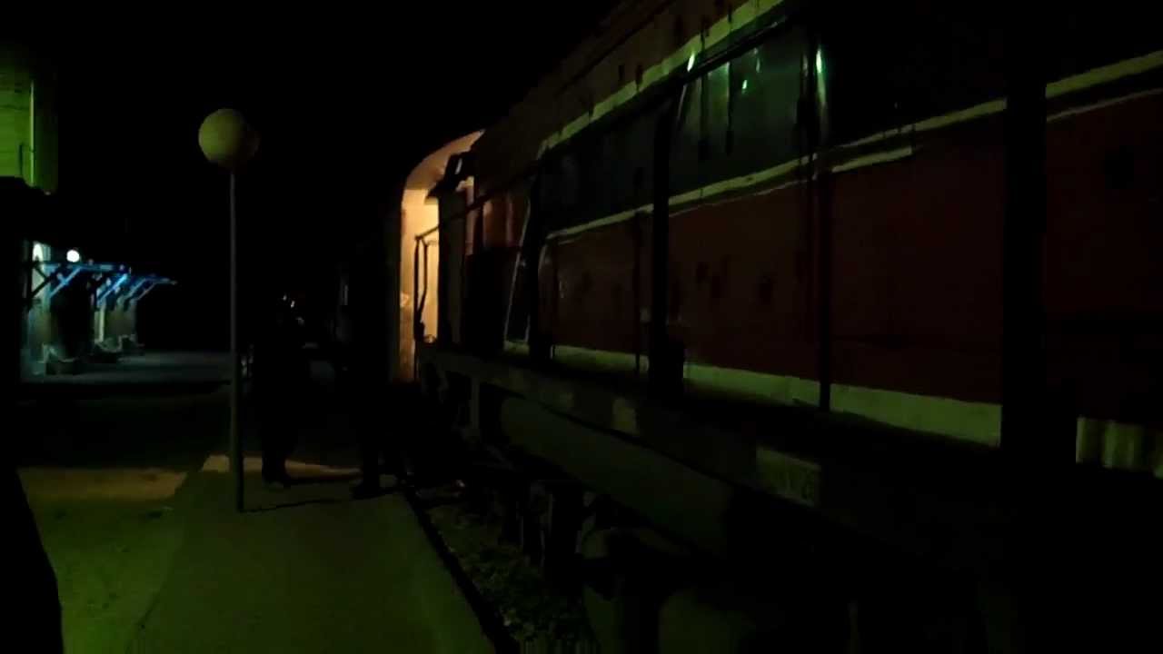 Tunisia Railway - Diesel locomotive train connecting to carriages at Tozeur rail station in Tunisia