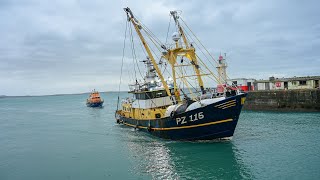 Beam Trawler Steph Of Ladram and The Penlee Lifeboat Entering Newlyn Harbour In Cornwall.
