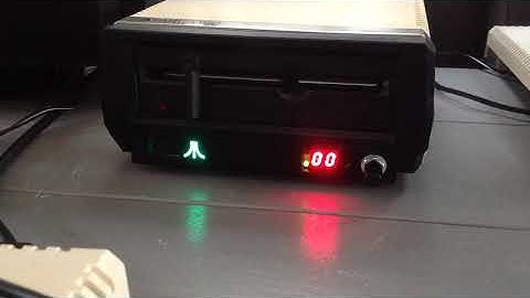 Atari 1050 floppy disk drive with Mega Speedy and modded LED power LED.