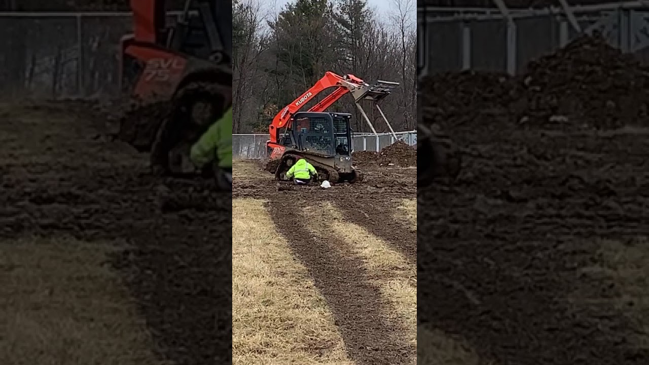 Guy swings from excavator and falls off