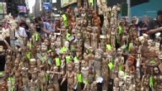 A ton of confiscated ivory was loaded onto a conveyor belt in Times Square and fed into a rock crush