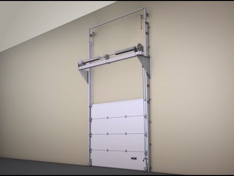 Installation d'une porte industrielle sectionnelle ProPlus ALUTECH à ouverture vertical.