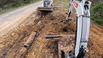 Installing a driveway culvert pipe. WE FOUND AN OLD CONCRETE CULVERT! Project 291 update Now what?