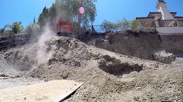 Tescar 2.5c Limited Access Drilling Rig driving up a sketchy narrow ramp