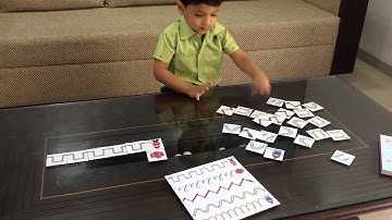 Moksh Busy with Cursive Patterns: A Pre-writing Activity 1/6