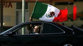 Why are so many cars displaying Mexican flags?