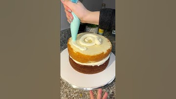 Stack and Crumb coat a cake #cakedecorating #cakeshorts #cakedesign