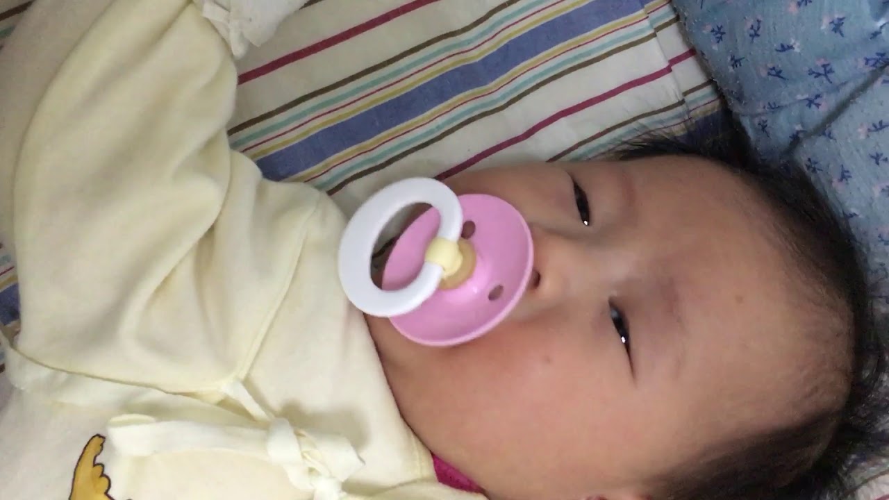 The baby is hungry, sucking the pacifier YouTube