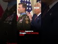 Trump Appears to Struggle While Fastening Medal