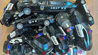 Box full of police toy cars - 4k