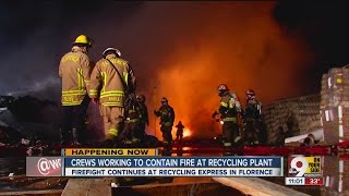 Crews working to contain fire at recycling plant