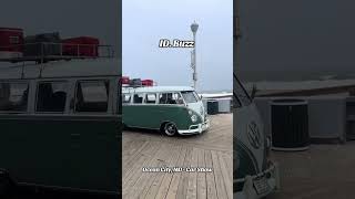 Old Volkswagen Bus up front, new VW bus (ID