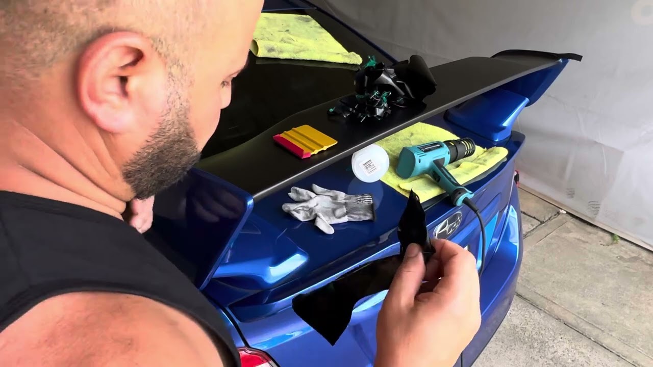 Wrapping The Top Part Of Spoiler On WRX STI Subaru In Matte Black Car Vinyl Wrap 