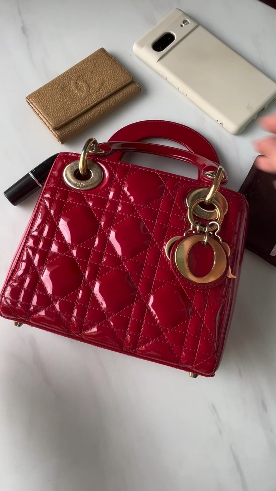 What fits in a lady Dior mini bag: iPhone pro max, wallet, cards