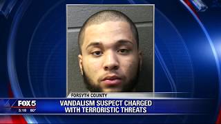 Vandalism suspects charged with terrorist threats