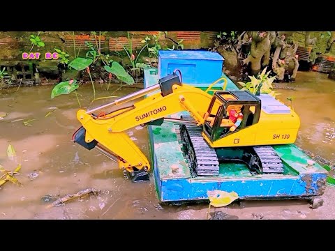 Video Xe cuốc đã độ lên trục vít test thử múc đất trên phà/... - youtube