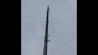 Wind sounds under a 1,000 foot tower.