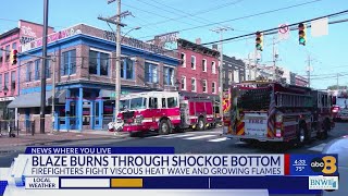 WATCH: Large fire burns through Richmond building, two firefighters hurt in extreme heat