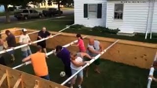 Woah! A life-sized human foosball table?