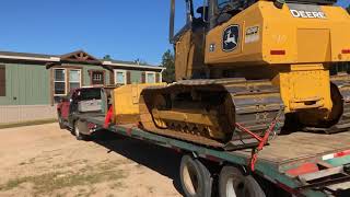 Moving A John Deere 650K With A Gooseneck