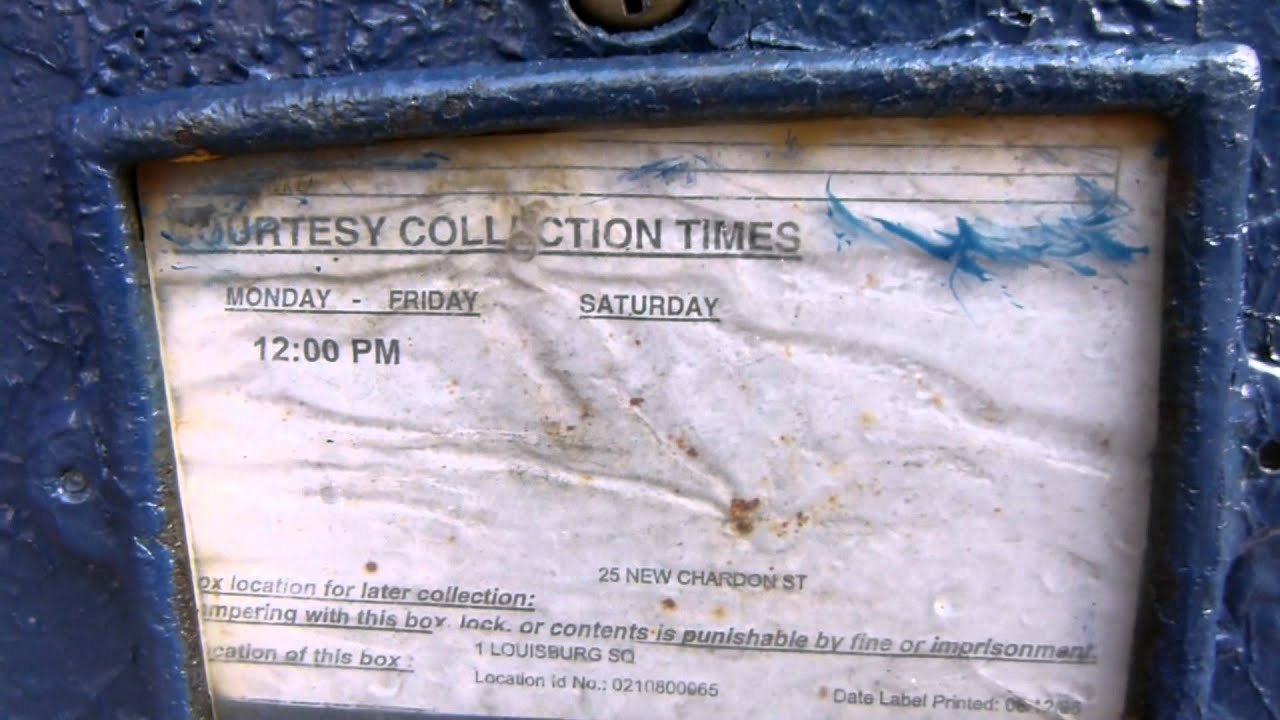 An ancient lamppost mounted mailbox in Louisburg Square