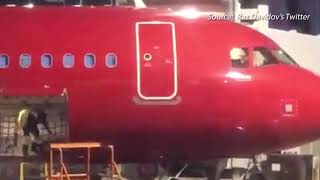 Alaska Airlines investigating video of worker throwing bags from plane