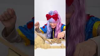 Driving a sandcastle in a cardboard car 
