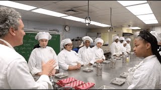 Oysters XO Teaching young Chefs How to Shuck at the Food and Finance High School.