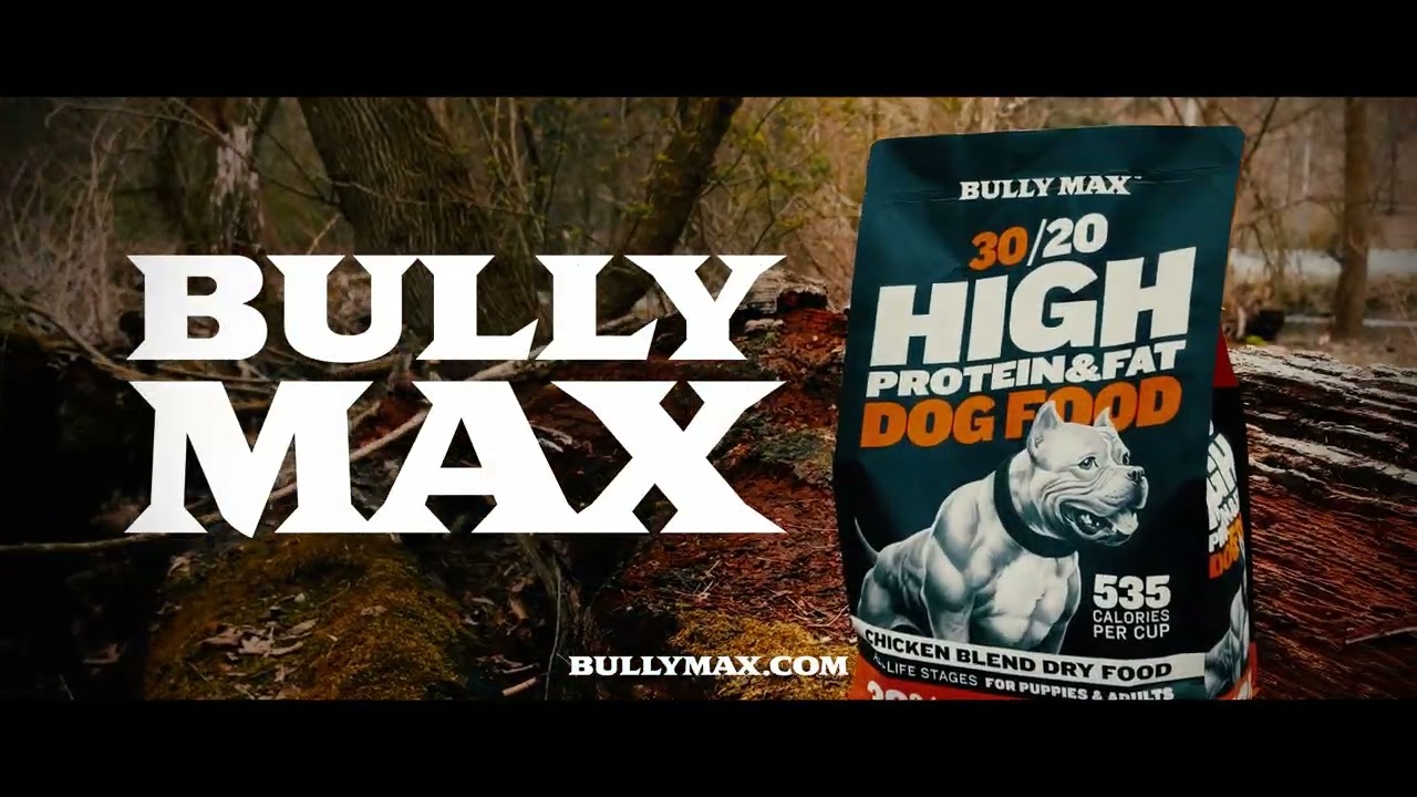 Bag of Bully Max 30/20 High Protein and Fat Dog Food on a fallen log in a forest