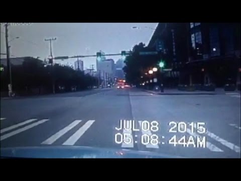 (Police dashcam) Semi truck blows through red light, watch what happens