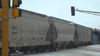 Nice! A CSX SD70MAC kicks up some snow as it heads north through Albert Lea.